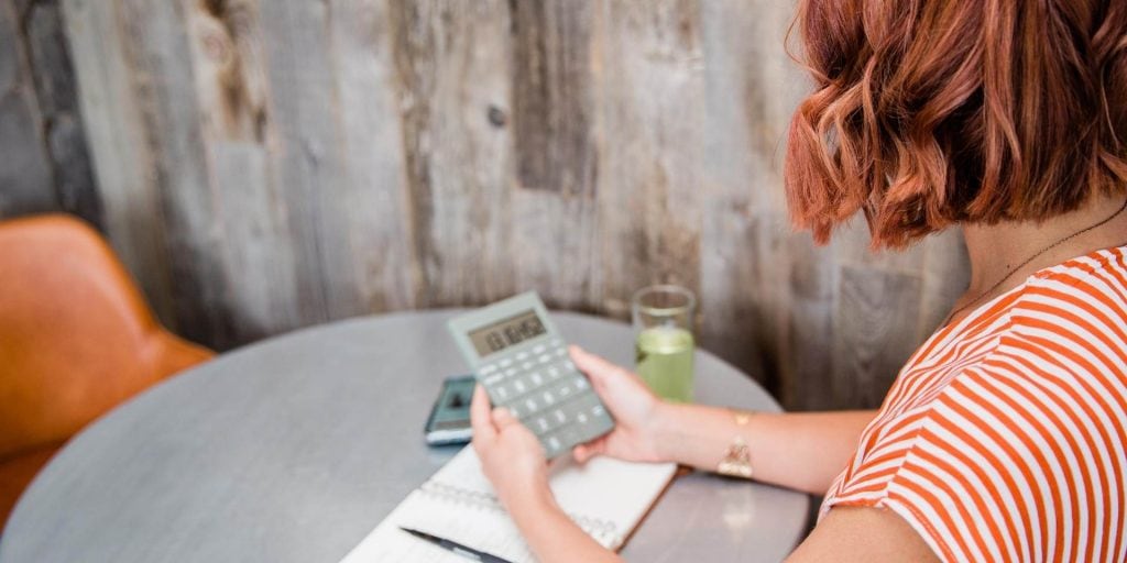 woman calculating how much of her husbands pension she is entitled to in divorce